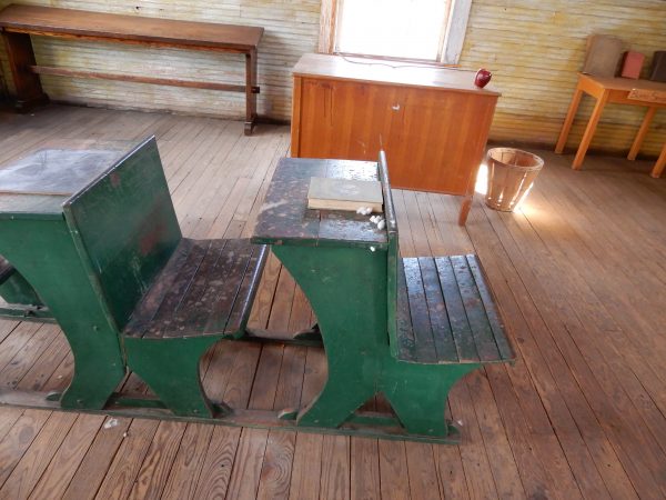 Teacher's desk and classroom reminiscent of the school days of Dr. Mays.